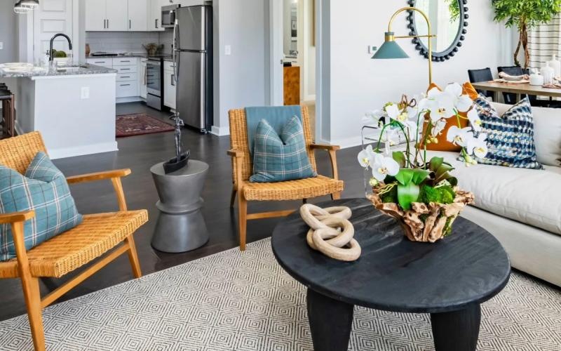 a living room with a couch and chairs